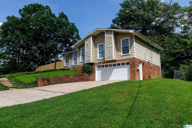 2517 Wright Cir, Birmingham, AL 35235 - view of front facade with a garage, brick siding, and concrete driveway