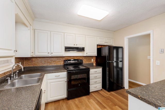 2517 Wright Cir, Birmingham, AL 35235 - kitchen featuring black appliances, under cabinet range hood, dark countertops, white cabinetry, and a textured ceiling