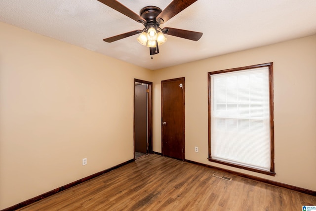 2517 Wright Cir, Birmingham, AL 35235 - spare room featuring wood finished floors and a ceiling fan