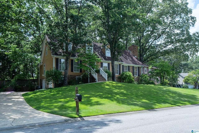 3518 William And Mary Rd, Hoover, AL 35216 - cape cod-style house with a front lawn and a garage