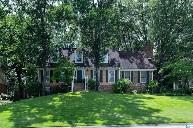 3518 William And Mary Rd, Hoover, AL 35216 - cape cod-style house featuring a front yard and a chimney