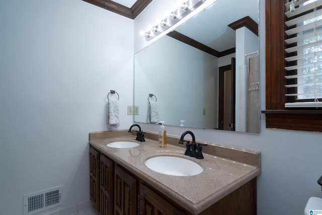 3518 William And Mary Rd, Hoover, AL 35216 - bathroom featuring double vanity and ornamental molding