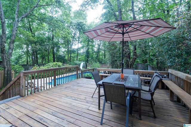 3518 William And Mary Rd, Hoover, AL 35216 - deck featuring outdoor dining space, a fenced backyard, and view of scattered trees