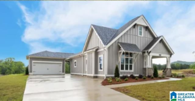 1234 Simms Rdg, Pelham, AL 35124 - craftsman inspired home featuring board and batten siding, concrete driveway, an attached garage, and a front yard