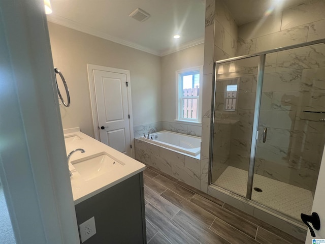 1234 Simms Rdg, Pelham, AL 35124 - full bathroom featuring a garden tub, ornamental molding, a marble finish shower, and double vanity