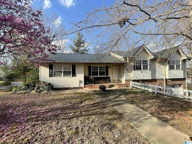 1529 Burnham Rd, Anniston, AL 36206 - split level home featuring covered porch and a metal roof