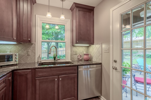2912 Monte Deste Dr, Hoover, AL 35216 - kitchen featuring dishwasher, tasteful backsplash, dark stone counters, and decorative light fixtures