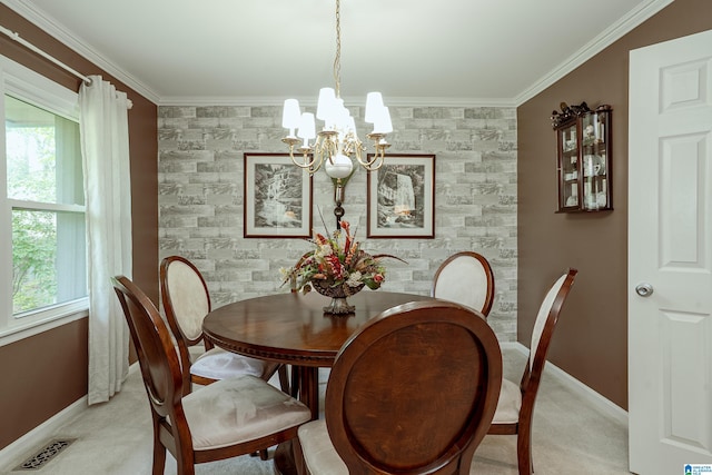 2912 Monte Deste Dr, Hoover, AL 35216 - dining area with an accent wall, healthy amount of natural light, a chandelier, and crown molding