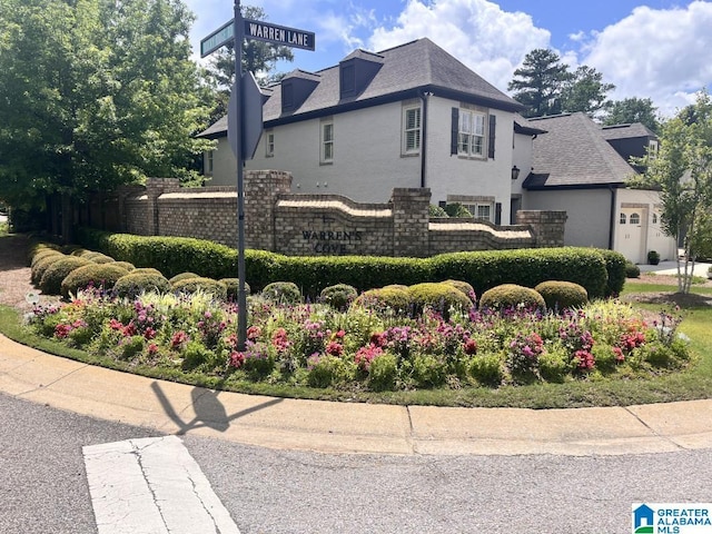1664 Warren Ln, Vestavia Hills, AL 35243 - view of side of home featuring a shingled roof and stucco siding