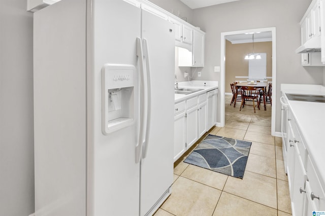 4033 Saddle Run Cir, Pelham, AL 35124 - kitchen featuring white appliances, light countertops, white cabinetry, under cabinet range hood, and light tile patterned floors