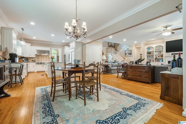 1007 Eagle Hill Dr, Birmingham, AL 35242 - dining area with crown molding, stairs, ceiling fan, light wood finished floors, and a chandelier