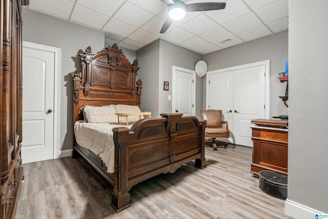 1007 Eagle Hill Dr, Birmingham, AL 35242 - bedroom with wood finished floors, a paneled ceiling, a closet, and a ceiling fan