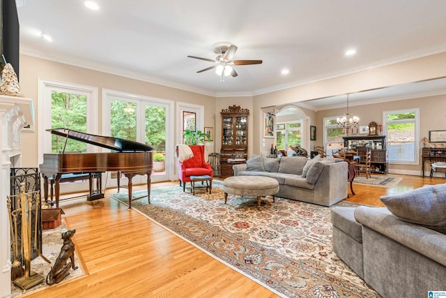 1007 Eagle Hill Dr, Birmingham, AL 35242 - living area featuring a chandelier, a ceiling fan, light wood-style flooring, crown molding, and recessed lighting