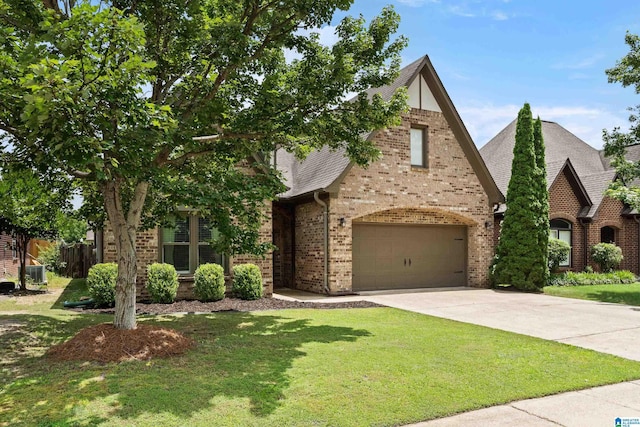 1185 Overlook Dr, Trussville, AL 35173 - view of front of property featuring brick siding, a front yard, and concrete driveway