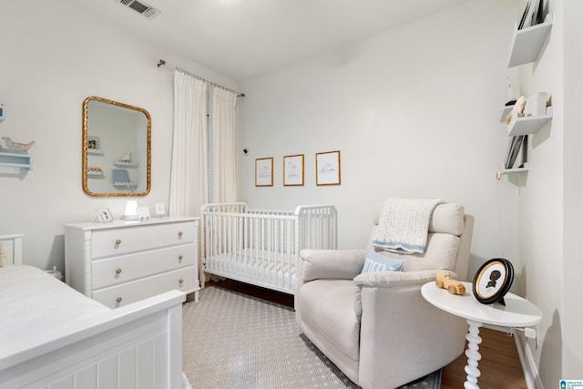 1185 Overlook Dr, Trussville, AL 35173 - bedroom with a crib and wood finished floors