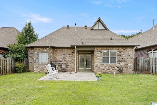 1185 Overlook Dr, Trussville, AL 35173 - rear view of house featuring a fenced backyard, brick siding, a patio area, and roof with shingles