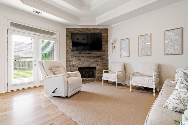 1185 Overlook Dr, Trussville, AL 35173 - living room with ornamental molding, light wood-type flooring, a fireplace, and a raised ceiling