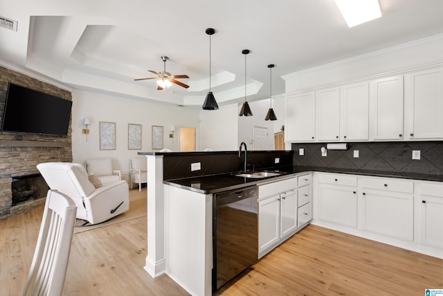 1185 Overlook Dr, Trussville, AL 35173 - kitchen featuring dishwashing machine, open floor plan, a peninsula, dark countertops, and crown molding