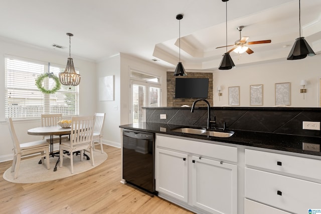 1185 Overlook Dr, Trussville, AL 35173 - kitchen with dishwasher, crown molding, light wood-type flooring, hanging light fixtures, and white cabinetry