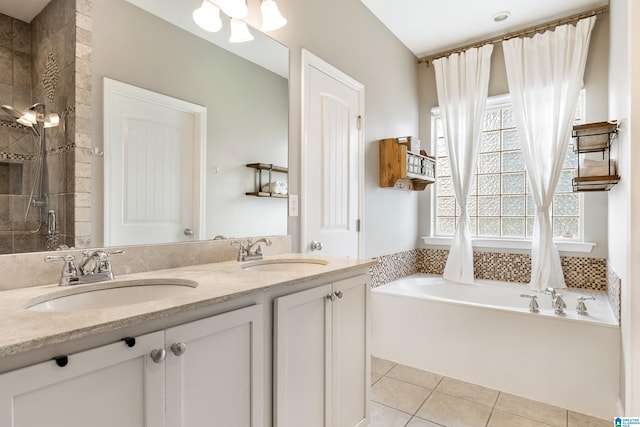 1185 Overlook Dr, Trussville, AL 35173 - bathroom featuring a garden tub, double vanity, tile patterned flooring, and a tile shower