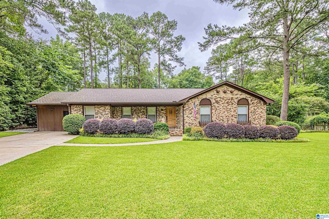 2191 Whiting Rd, Hoover, AL 35216 - view of front facade featuring a front lawn, concrete driveway, brick siding, and a porch