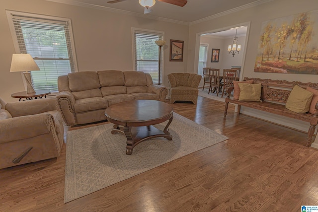 2191 Whiting Rd, Hoover, AL 35216 - living area featuring crown molding, ceiling fan, wood finished floors, and a chandelier