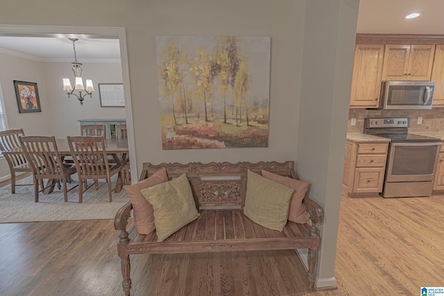2191 Whiting Rd, Hoover, AL 35216 - living room with a chandelier, crown molding, light wood-type flooring, and recessed lighting