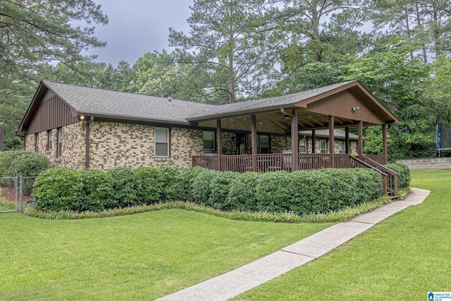2191 Whiting Rd, Hoover, AL 35216 - view of front facade with a trampoline, brick siding, and roof with shingles
