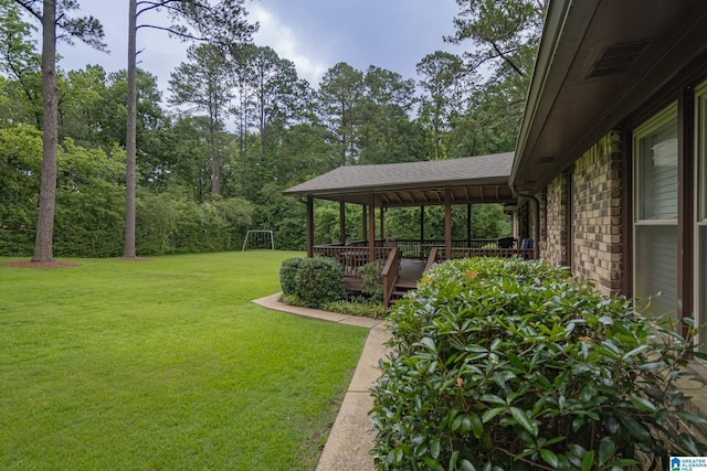 2191 Whiting Rd, Hoover, AL 35216 - view of green lawn with a deck and view of wooded area
