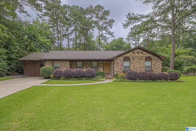 2191 Whiting Rd, Hoover, AL 35216 - ranch-style house featuring a front yard, concrete driveway, and brick siding