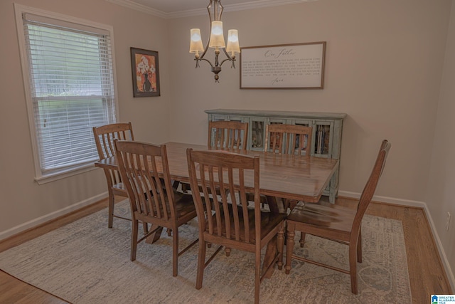 2191 Whiting Rd, Hoover, AL 35216 - dining space with crown molding, wood finished floors, and a chandelier