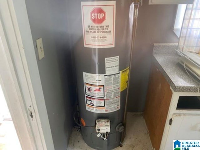 209 61st St, Fairfield, AL 35064 - utility room featuring water heater