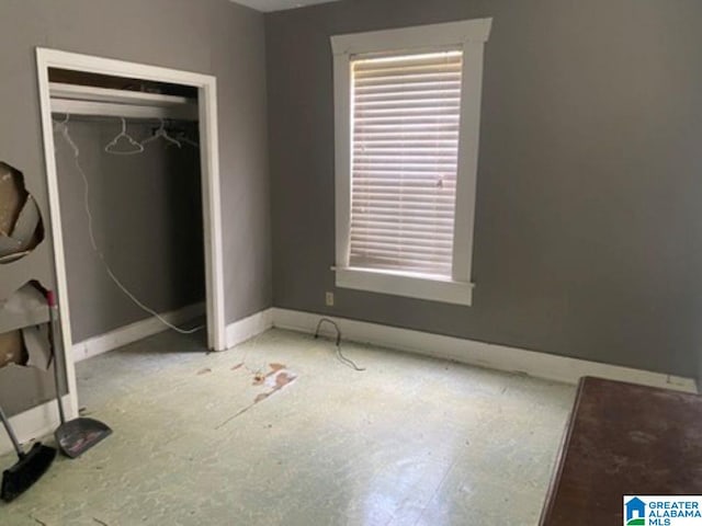 209 61st St, Fairfield, AL 35064 - unfurnished bedroom with a closet and baseboards