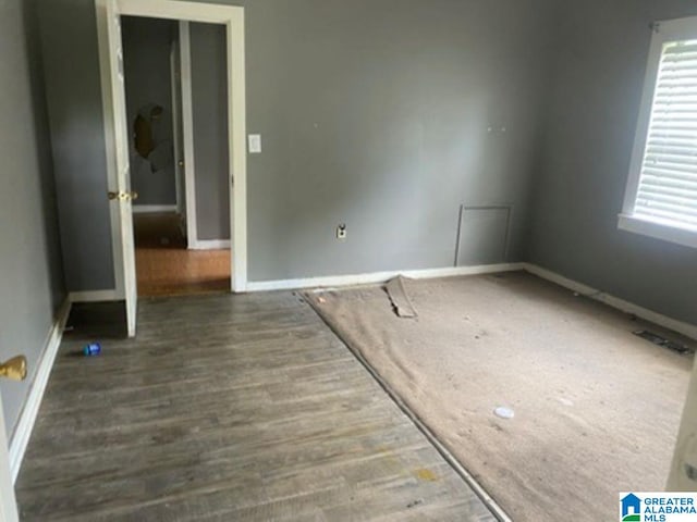 209 61st St, Fairfield, AL 35064 - unfurnished room featuring baseboards and wood finished floors