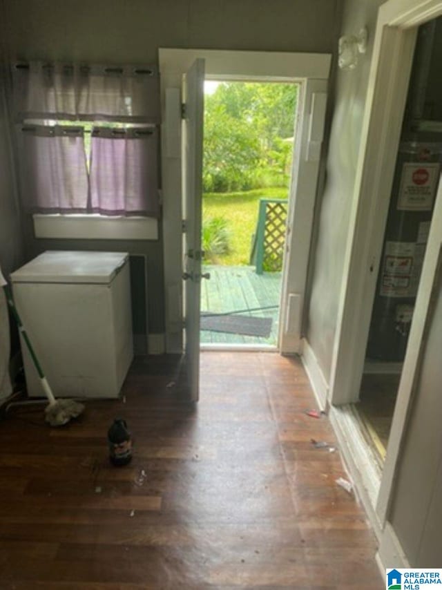 209 61st St, Fairfield, AL 35064 - laundry area featuring wood finished floors and water heater