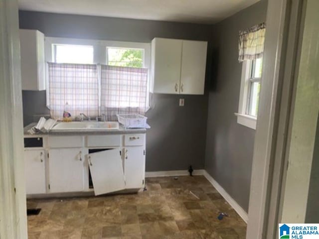 209 61st St, Fairfield, AL 35064 - kitchen with white cabinets and healthy amount of natural light