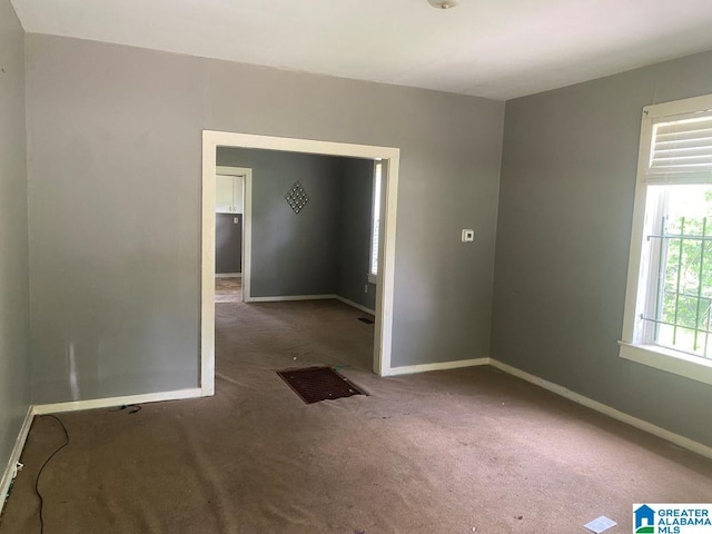 209 61st St, Fairfield, AL 35064 - carpeted empty room with baseboards