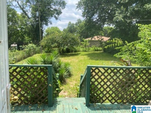 209 61st St, Fairfield, AL 35064 - view of grassy yard featuring a deck