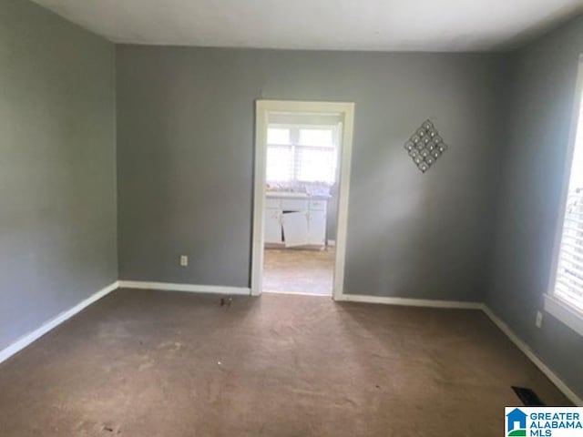 209 61st St, Fairfield, AL 35064 - carpeted spare room with baseboards