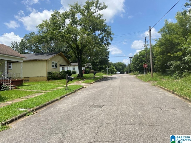 209 61st St, Fairfield, AL 35064 - view of asphalt street with traffic signs and curbs