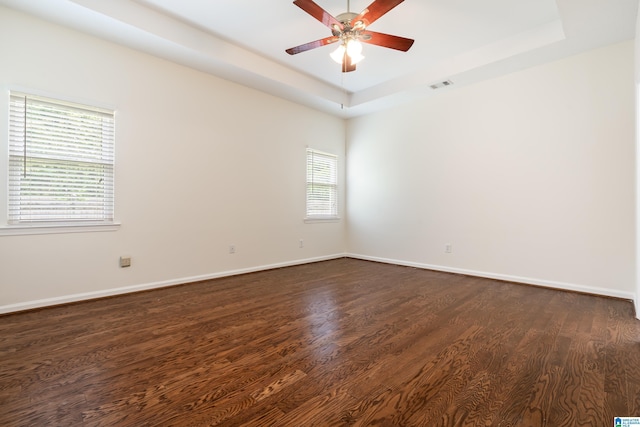 313 Chadwick Pl, Helena, AL 35080 - unfurnished room featuring dark wood-type flooring, a tray ceiling, and a ceiling fan
