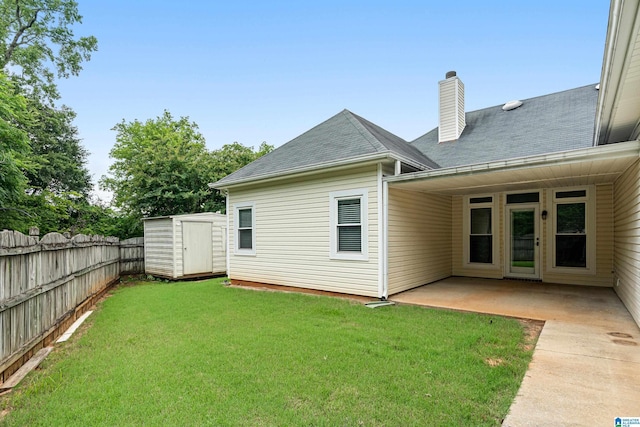 313 Chadwick Pl, Helena, AL 35080 - back of property with a fenced backyard, a patio, a shed, a chimney, and a shingled roof