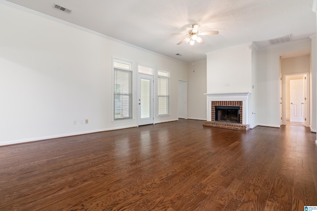 313 Chadwick Pl, Helena, AL 35080 - unfurnished living room featuring a ceiling fan, crown molding, a fireplace, and dark wood finished floors