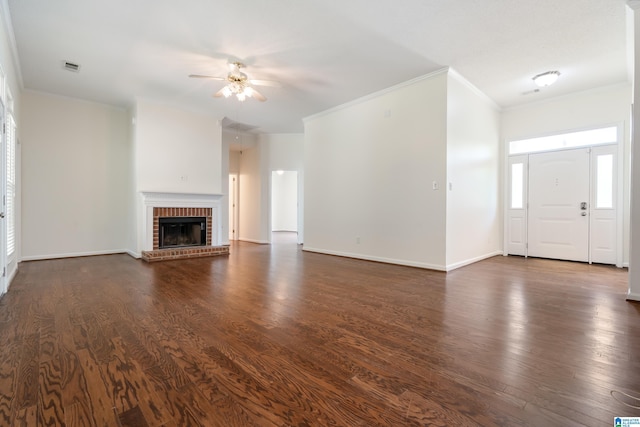 313 Chadwick Pl, Helena, AL 35080 - unfurnished living room with crown molding, dark wood finished floors, a brick fireplace, and ceiling fan