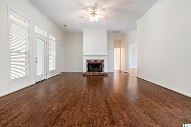 313 Chadwick Pl, Helena, AL 35080 - unfurnished living room featuring ornamental molding, ceiling fan, a brick fireplace, dark wood finished floors, and healthy amount of natural light