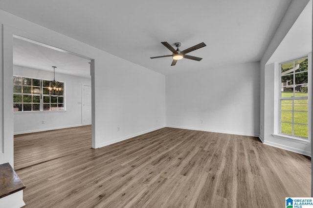 8312 Country Cir, Pinson, AL 35126 - spare room with a chandelier, healthy amount of natural light, wood finished floors, and ceiling fan