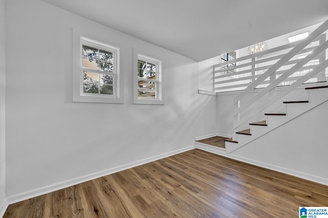 8312 Country Cir, Pinson, AL 35126 - stairway featuring wood finished floors and a chandelier