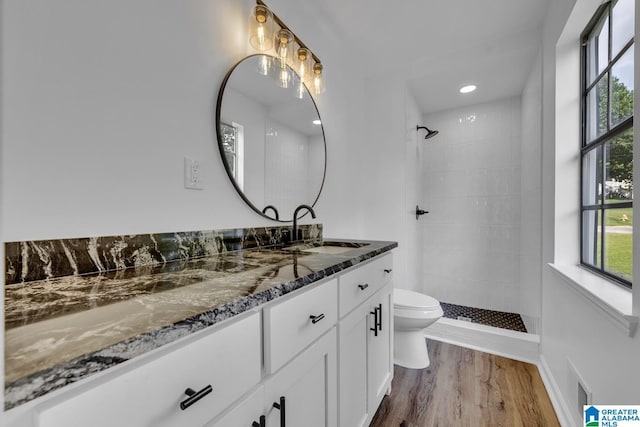 8312 Country Cir, Pinson, AL 35126 - full bath with vanity, a tile shower, and wood finished floors