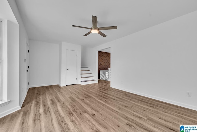 8312 Country Cir, Pinson, AL 35126 - unfurnished living room with wood finished floors and ceiling fan