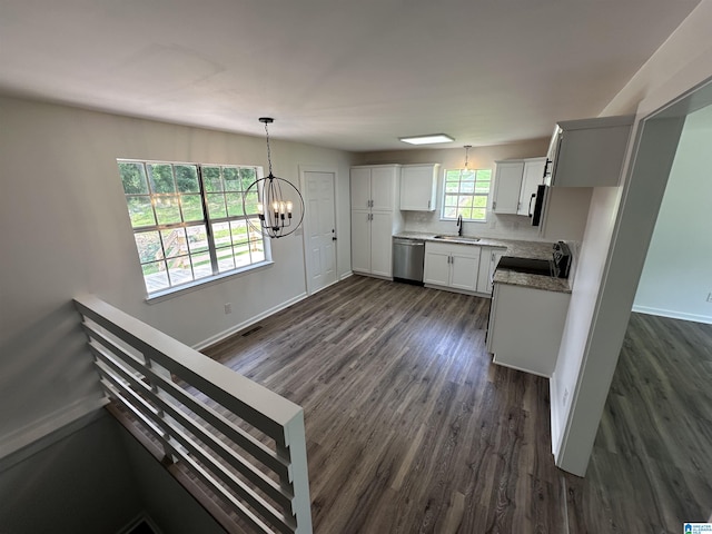 8312 Country Cir, Pinson, AL 35126 - kitchen with dishwasher, dark wood finished floors, a chandelier, range, and white cabinetry